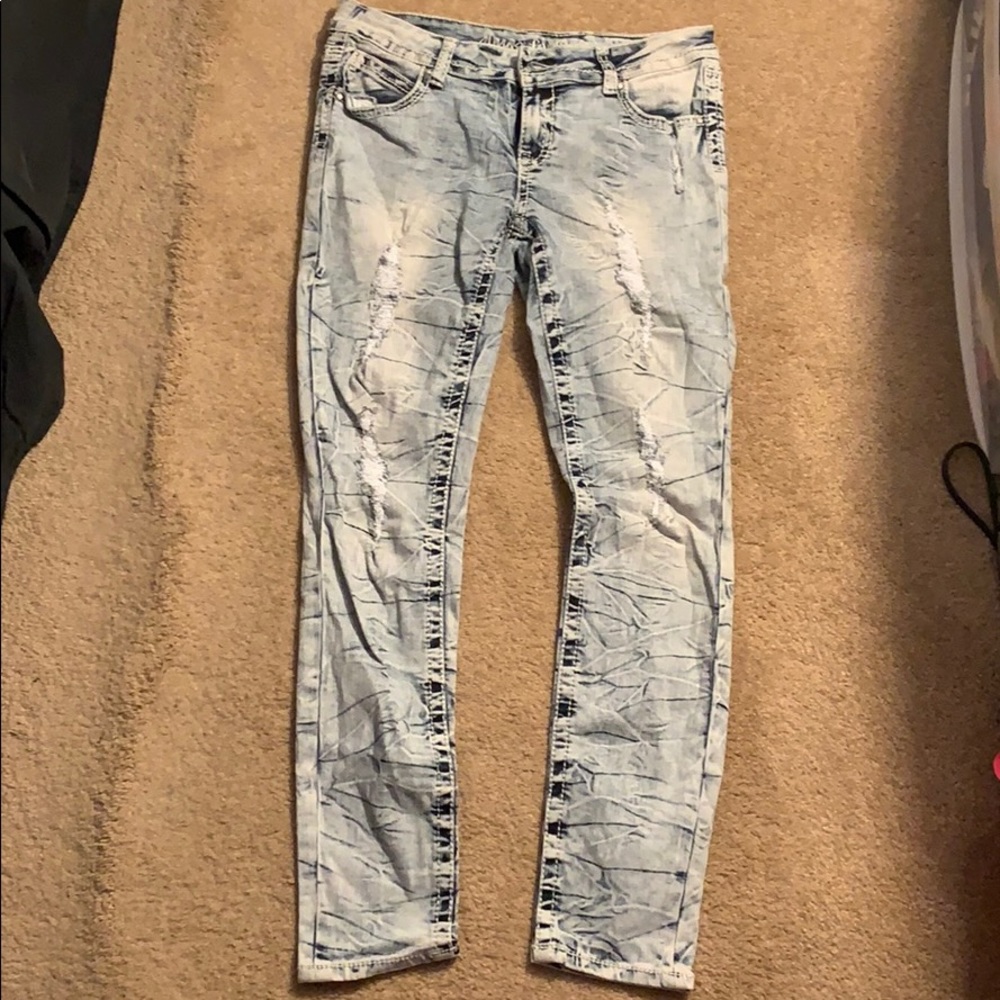 Light wash distressed skinny jeans
